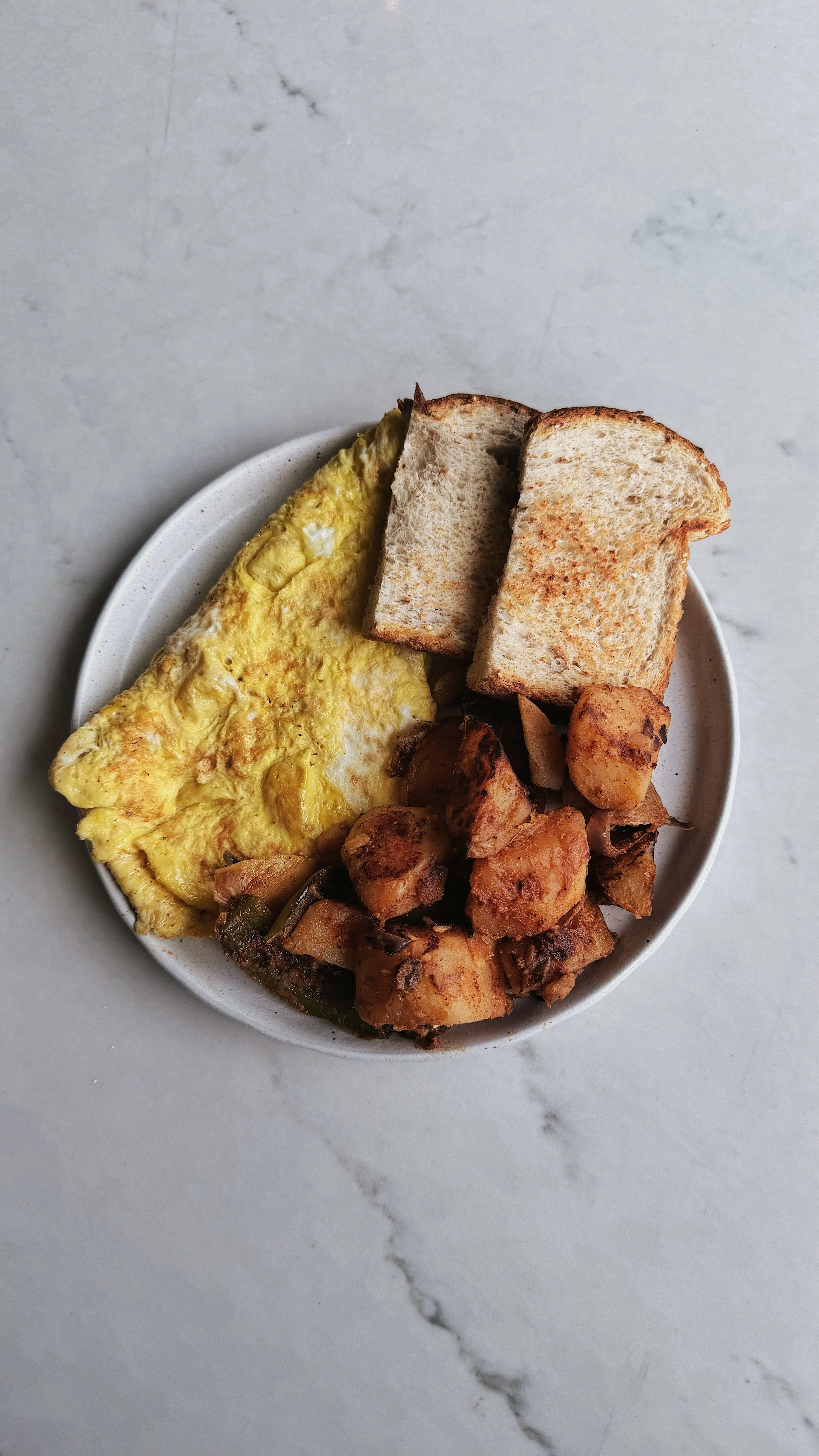 omelette served with toast and home fries