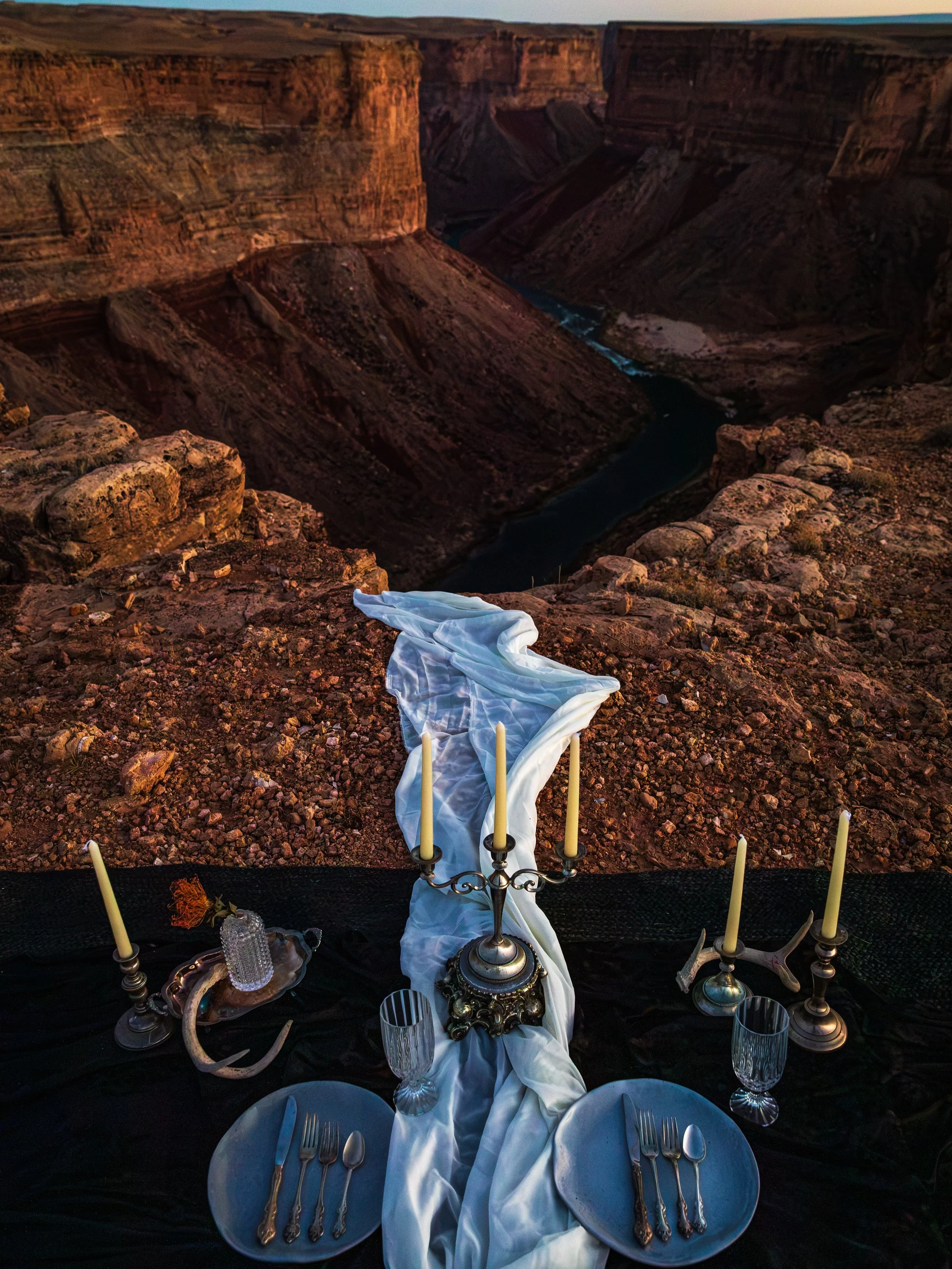 At the edge of the desert, a table for two.

Black velvet, silver and silk gathered above a river carved through stone. A quiet place to watch the last light disappear.

Who would you meet here at sunset?

Photography by @alecscottphoto

#UnderTheRun