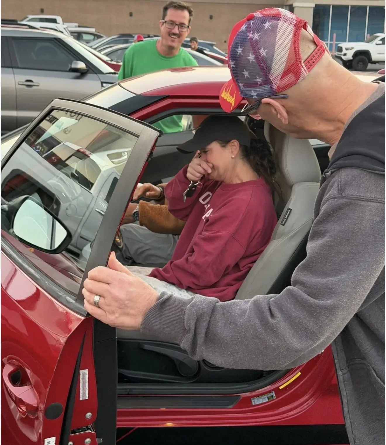 man and wife receiving car