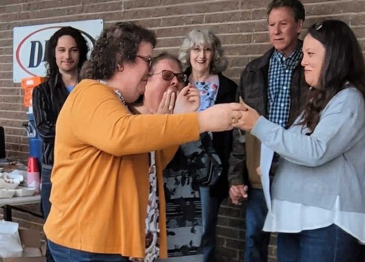 ladies celebrating receiving a car