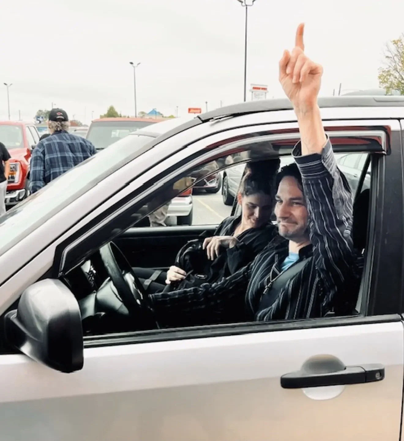 man giving God thanks for receiving a car