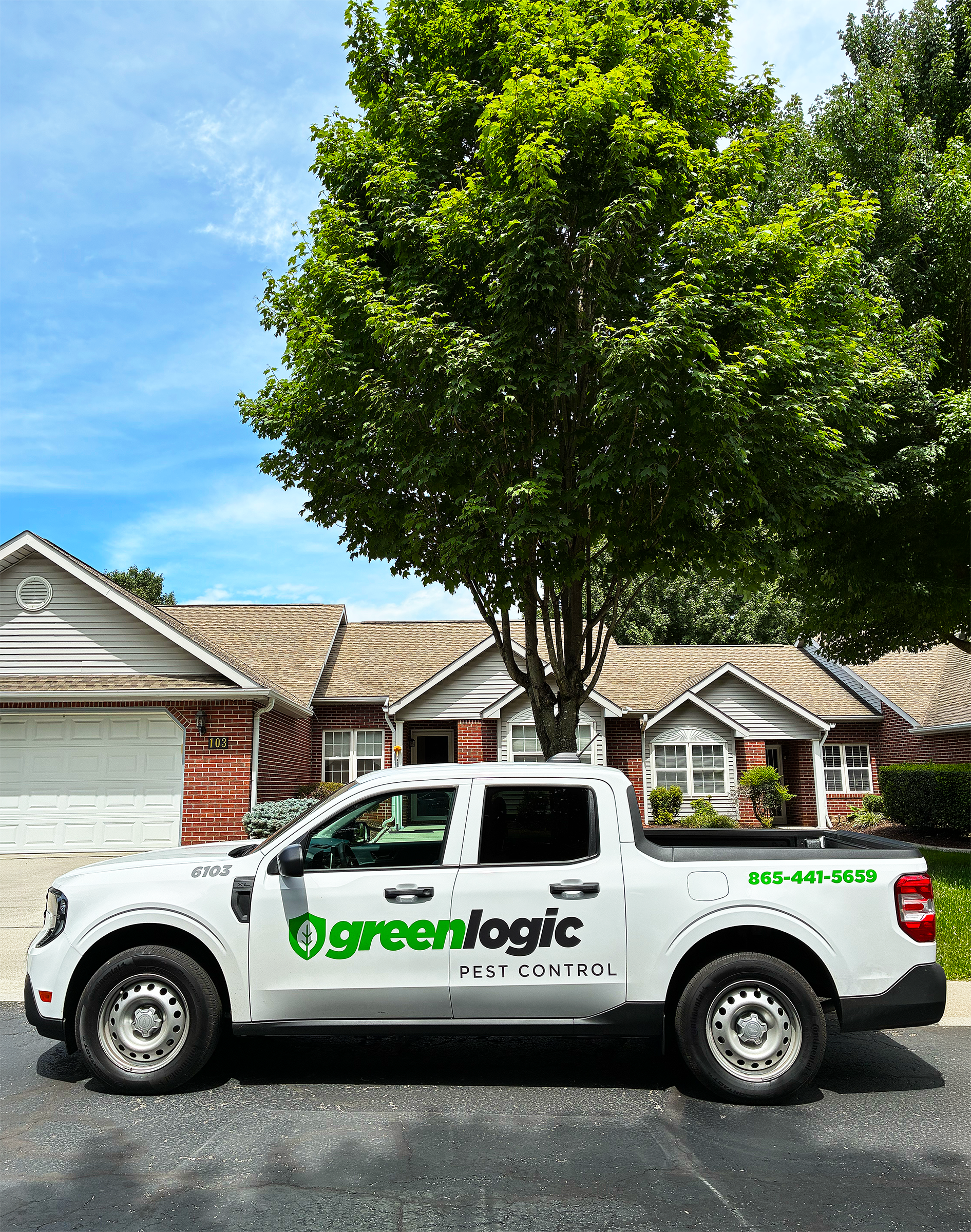 Greenlogic Pest Control Truck in front of customer's home