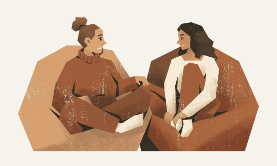 Two women sitting on brown armchairs facing each other, engaging in conversation.