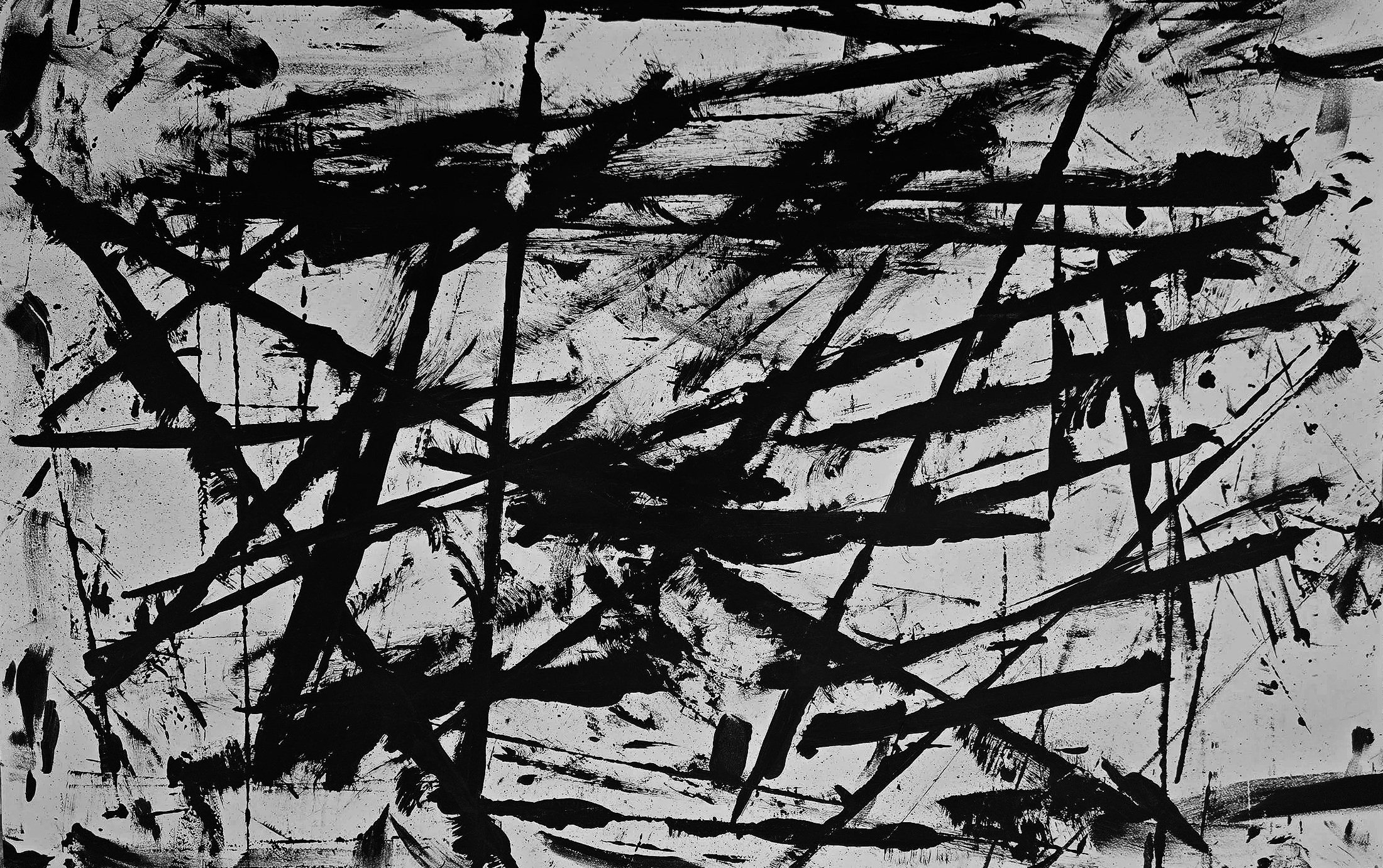 Abstract black paint splatters and strokes on a white background, resembling an expressionist painting.