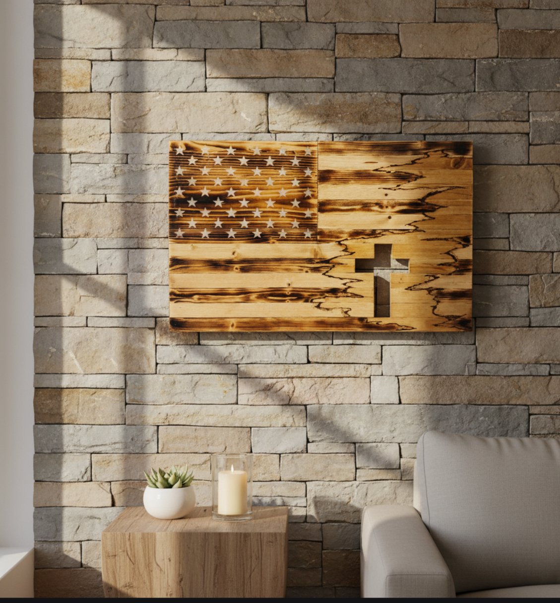 Handcrafted wooden American flag wall art with carved cross, displayed on a stone accent wall.