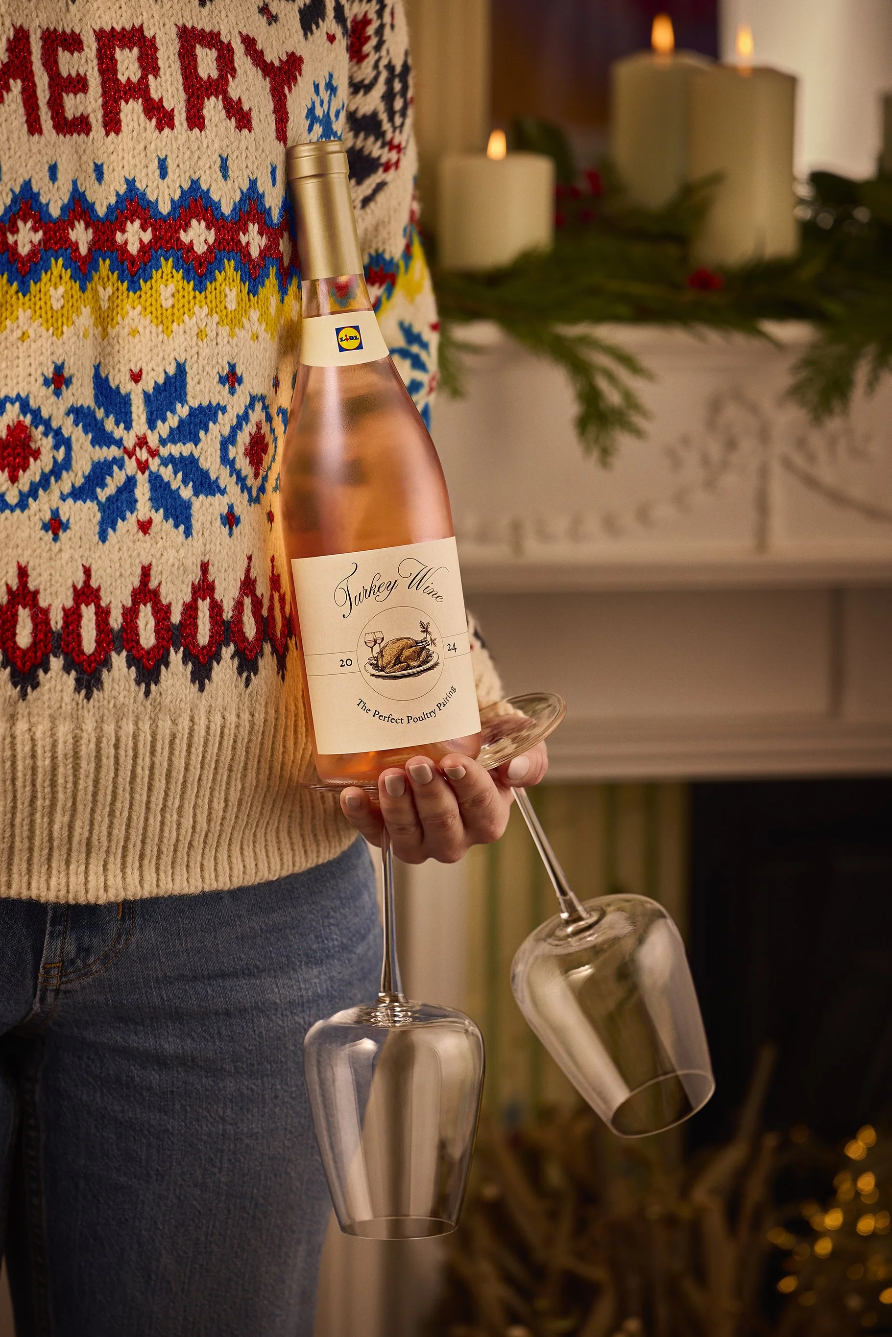 HandHeldWithGlassesByFireplace_Lidl_TurkeyWine_RT.jpg