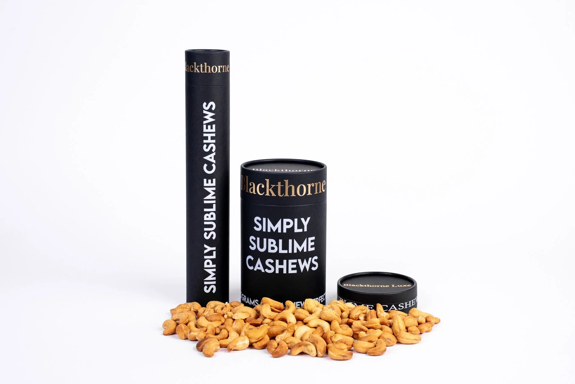 Blackthorne Simply Sublime Cashews packaging with cashews spilled at the base on a white background.
