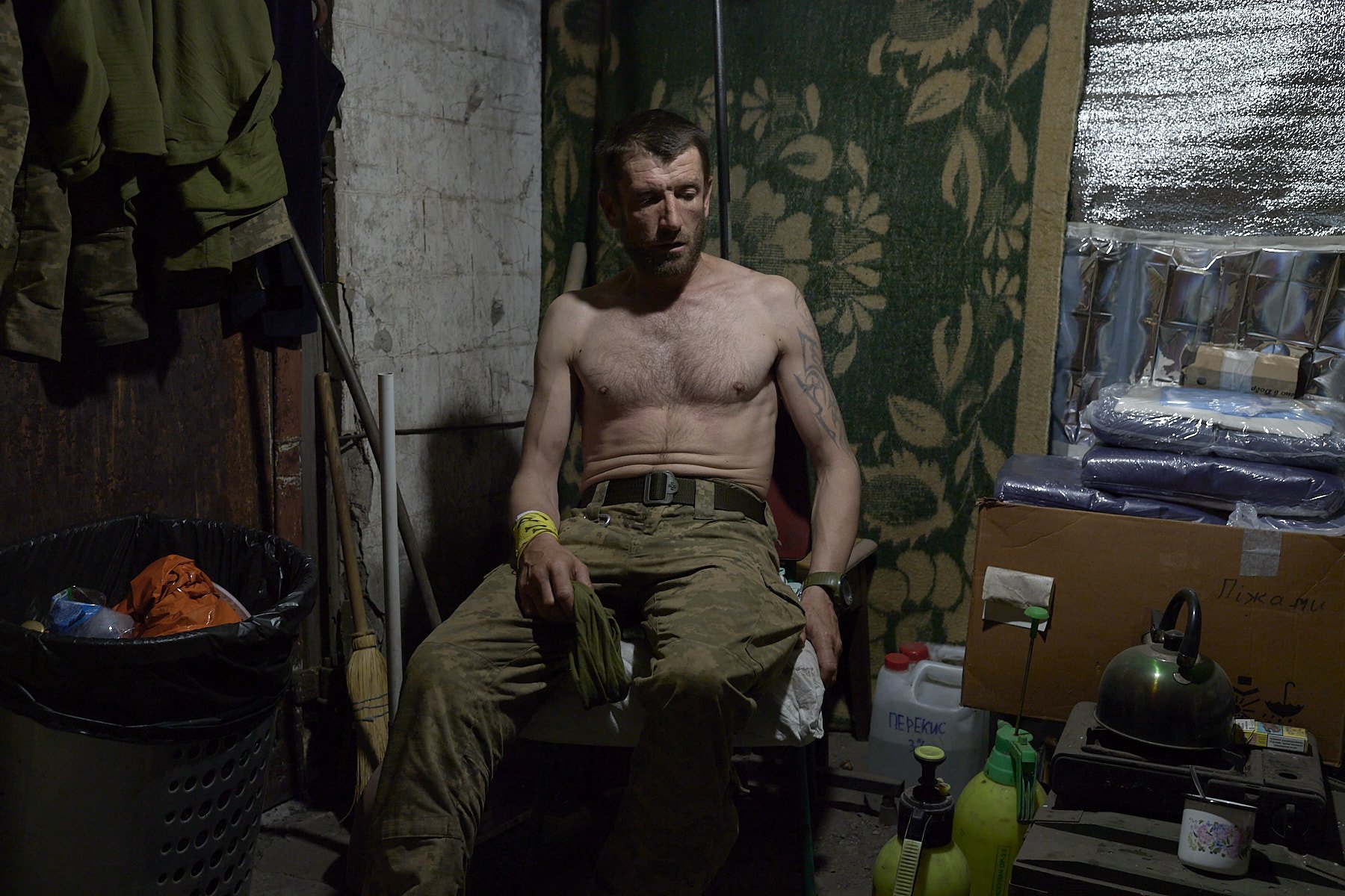 POKROVSK, UKRAINE, JULY 9, 2025. Alexander, 41, soldier on the frontline waiting in a field hospital, exhausted from lack of sleep. He has been wounded by a drone.