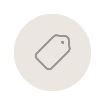 A simple illustration of a price tag icon in gray, centered on a white circular background.