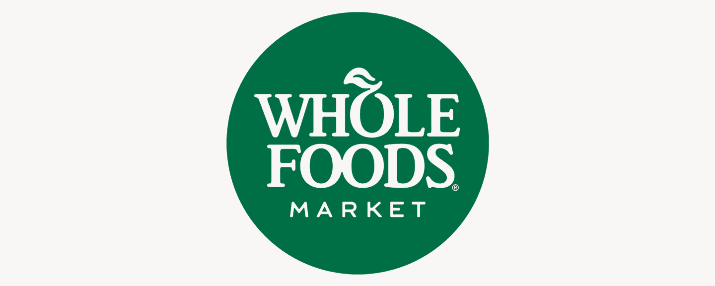 Whole Foods Market logo with green circle and white text
