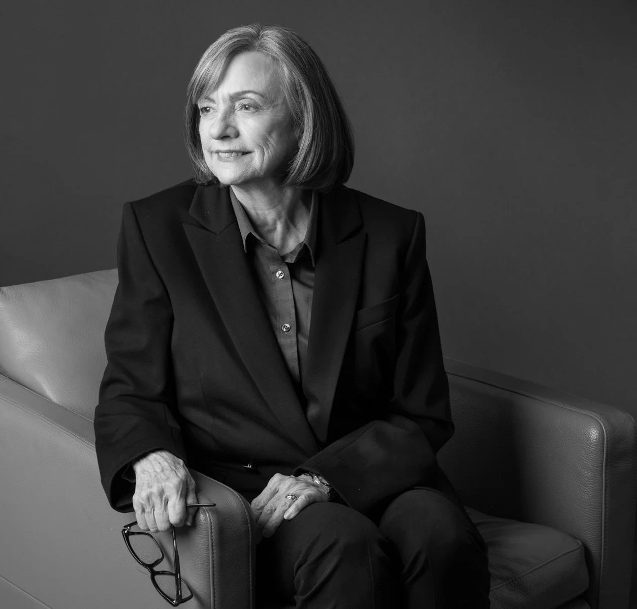 Black-and-white portrait of Sunnee D. O’Rork, Principal of O’Rork Consulting, seated and looking off-camera.
