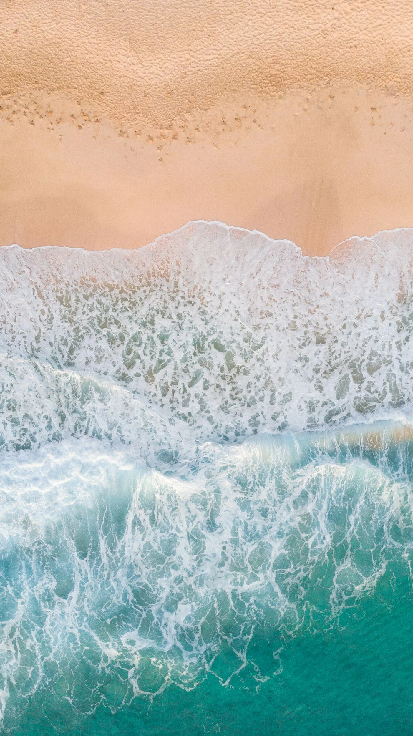 Waves crash onto shore