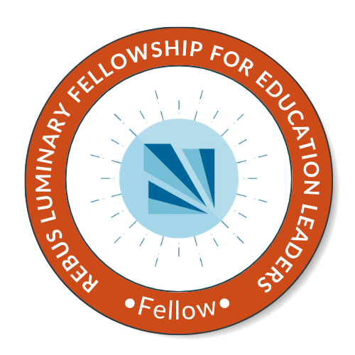 A circular badge for Rebus Luminous Fellowship for Education Leaders, featuring a blue and white emblem in the center with a stylized 'L' and rays of light, and an orange ring with white text surrounding it.