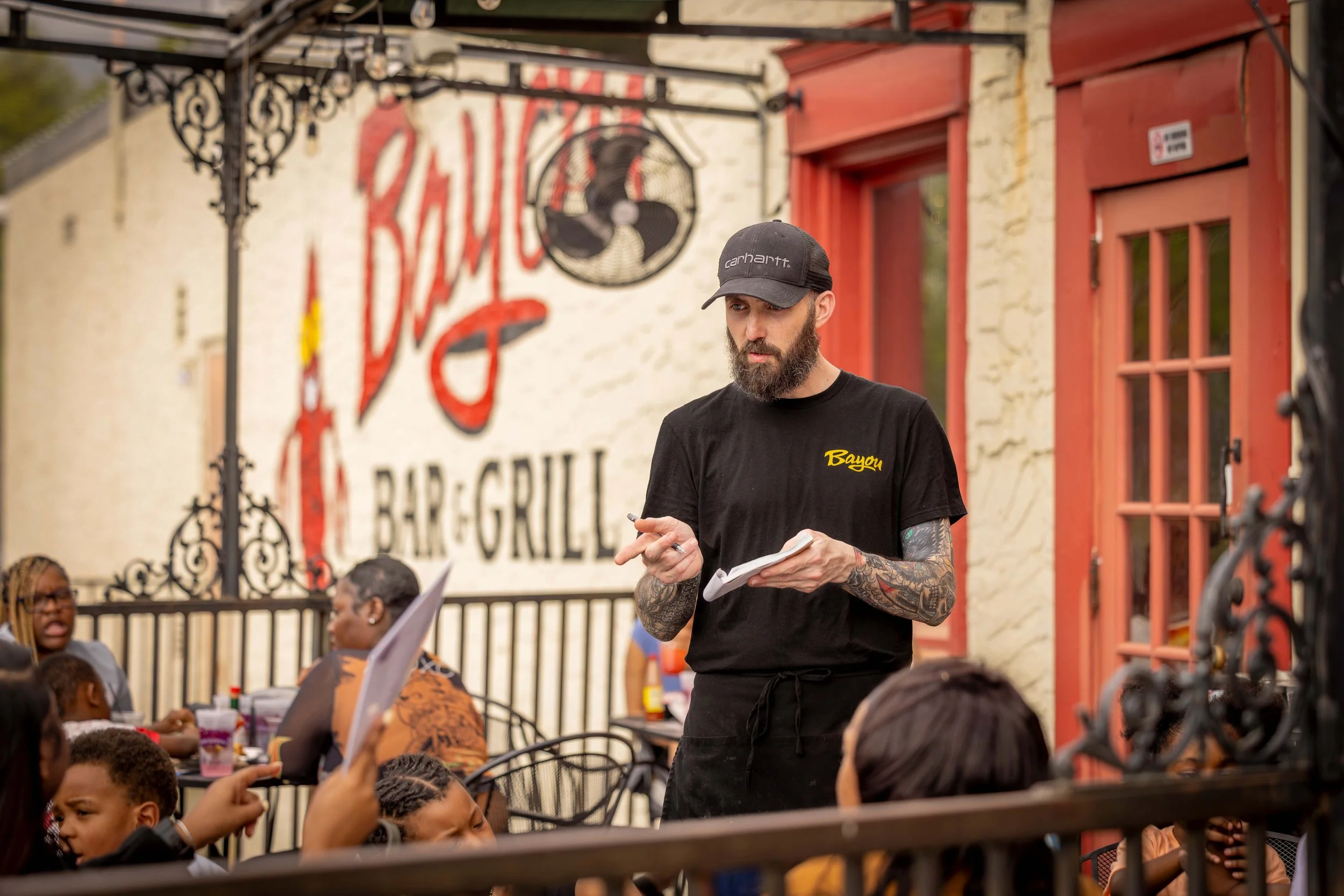 Server taking customers order.