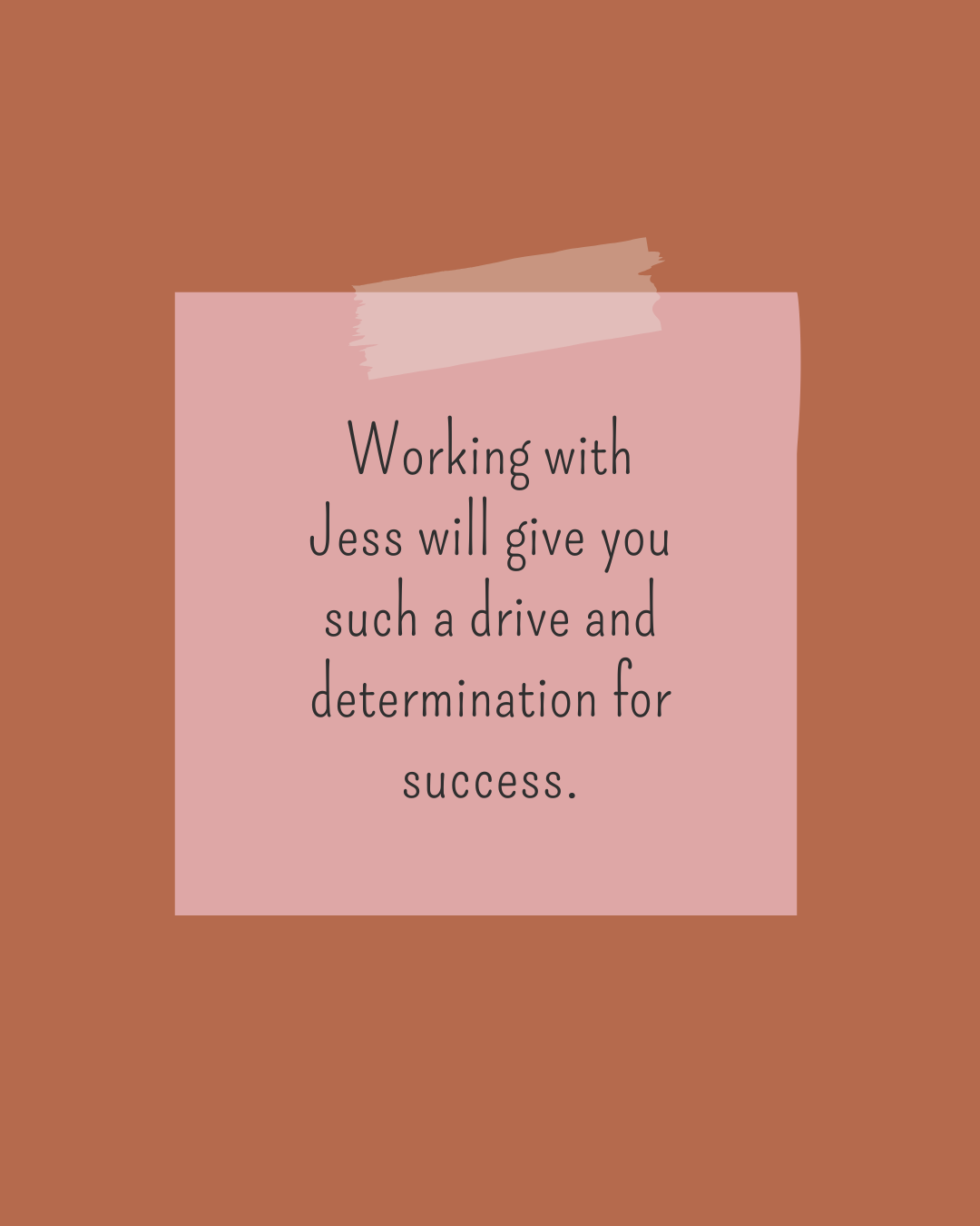 A motivational quote on a pink paper taped to a brown wall