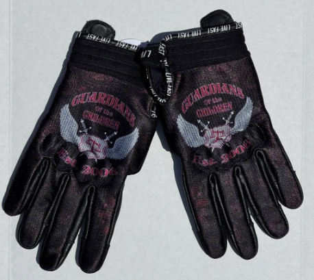 Pair of black gloves with a skull and crossbones logo and text, featuring a pink and gray design.