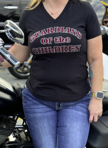 Women's black T-shirt with 'Guardians of the Children' logo.