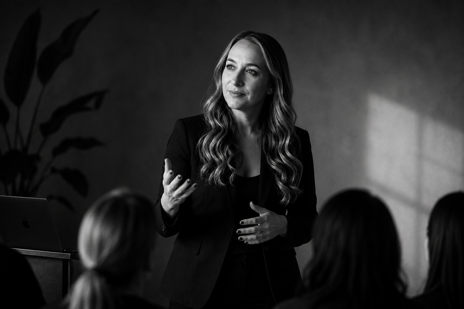 Amy Oughton presenting to an audience during a professional voice workshop.
