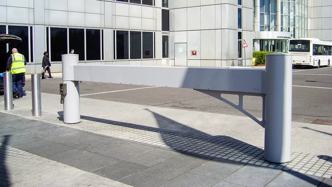 Crash-rated vehicle barrier gate at a building entrance