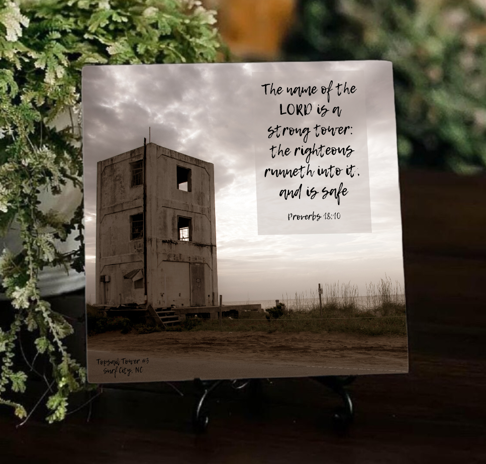 Decorative tile with inspirational quote against a scenic background