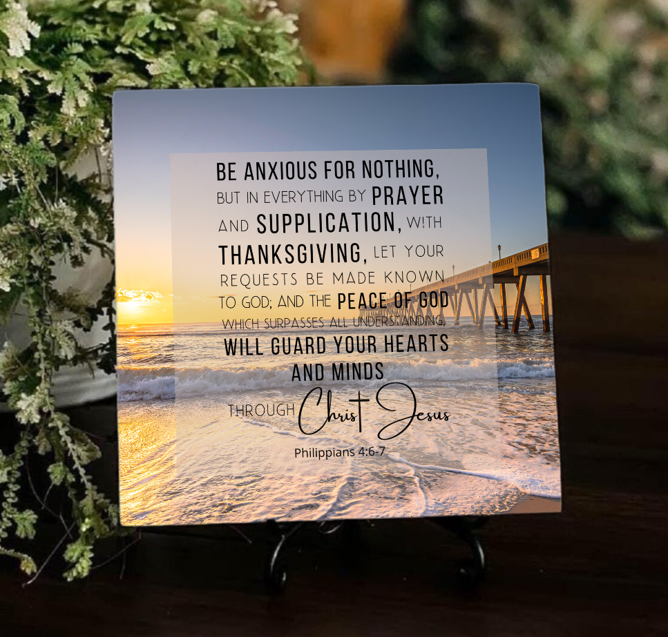 ceramic tile design on display stand with ocean sunset scripture in background