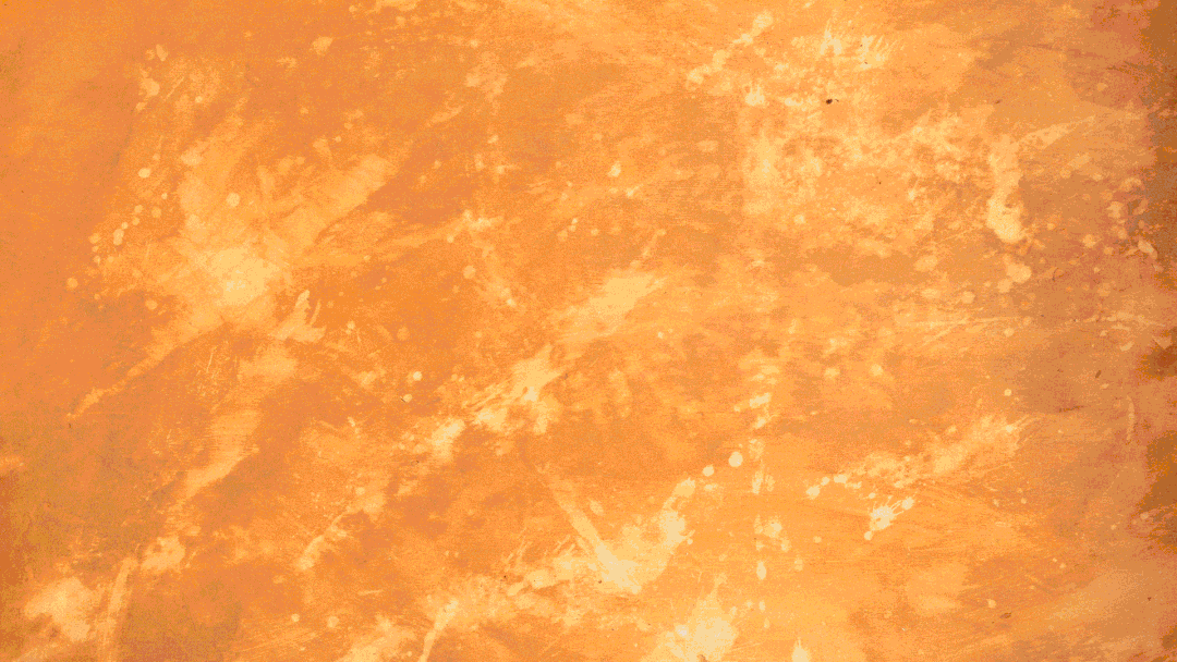 Abstract orange and yellow textured background with splatter and swirl patterns.