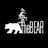 Silhouette of a bear walking in front of a logo with the text 'theBEAR'
