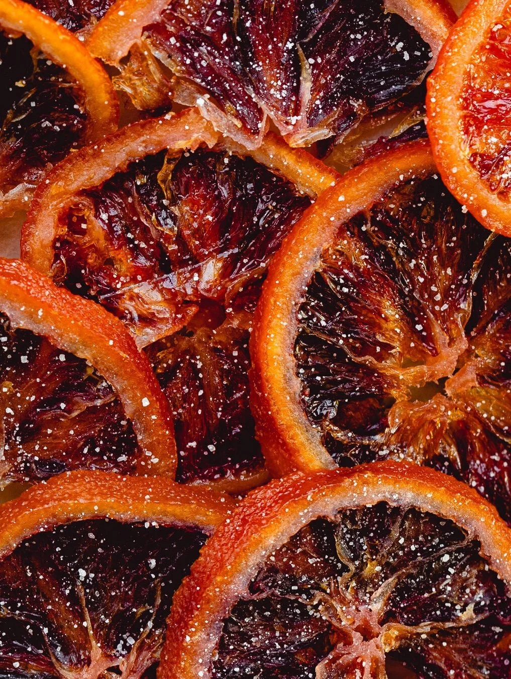 Close-up of dried blood orange slices sprinkled with salt.