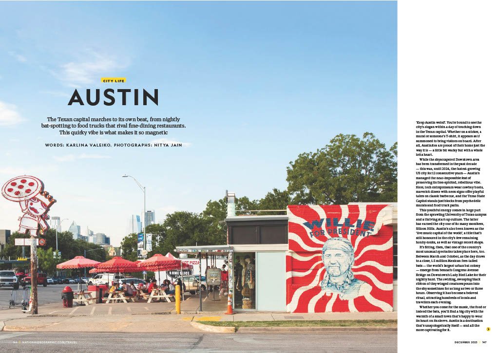 A street scene in Austin, Texas, with outdoor dining areas, a mural with a caricature and red/white swirls, and city skyscrapers in the background under a clear blue sky.
