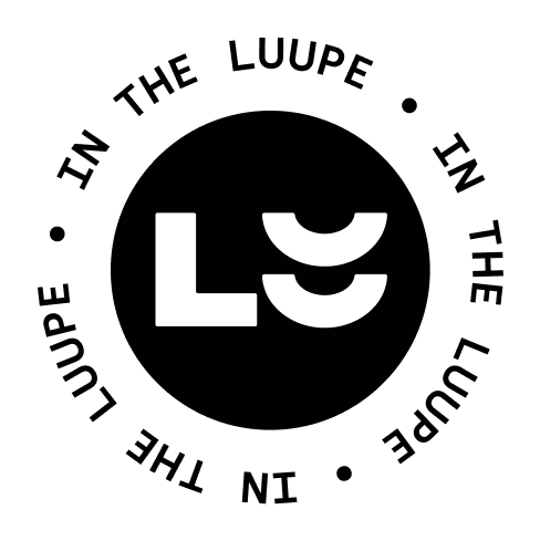 Black and white logo with the text 'In the Luup' surrounding a black circle with stylized white initials 'L' and 'U' inside.