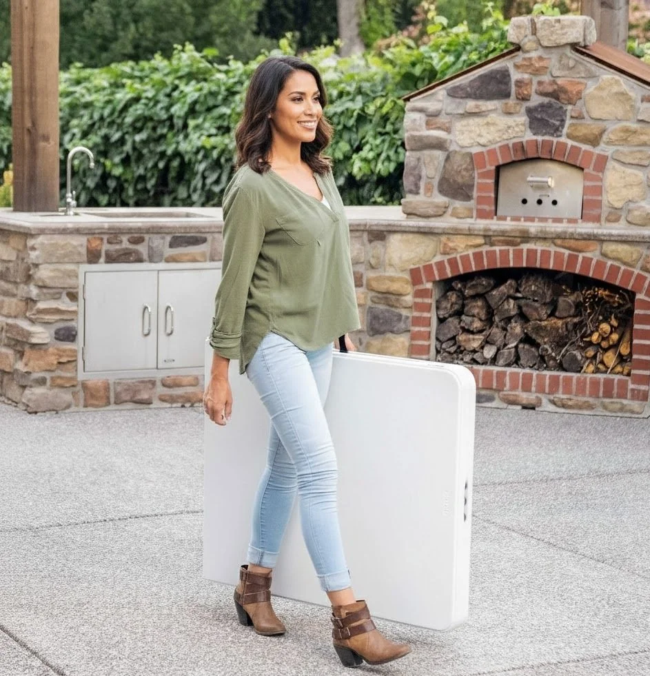 guest holding folding table for backyard party setup in Sacramento