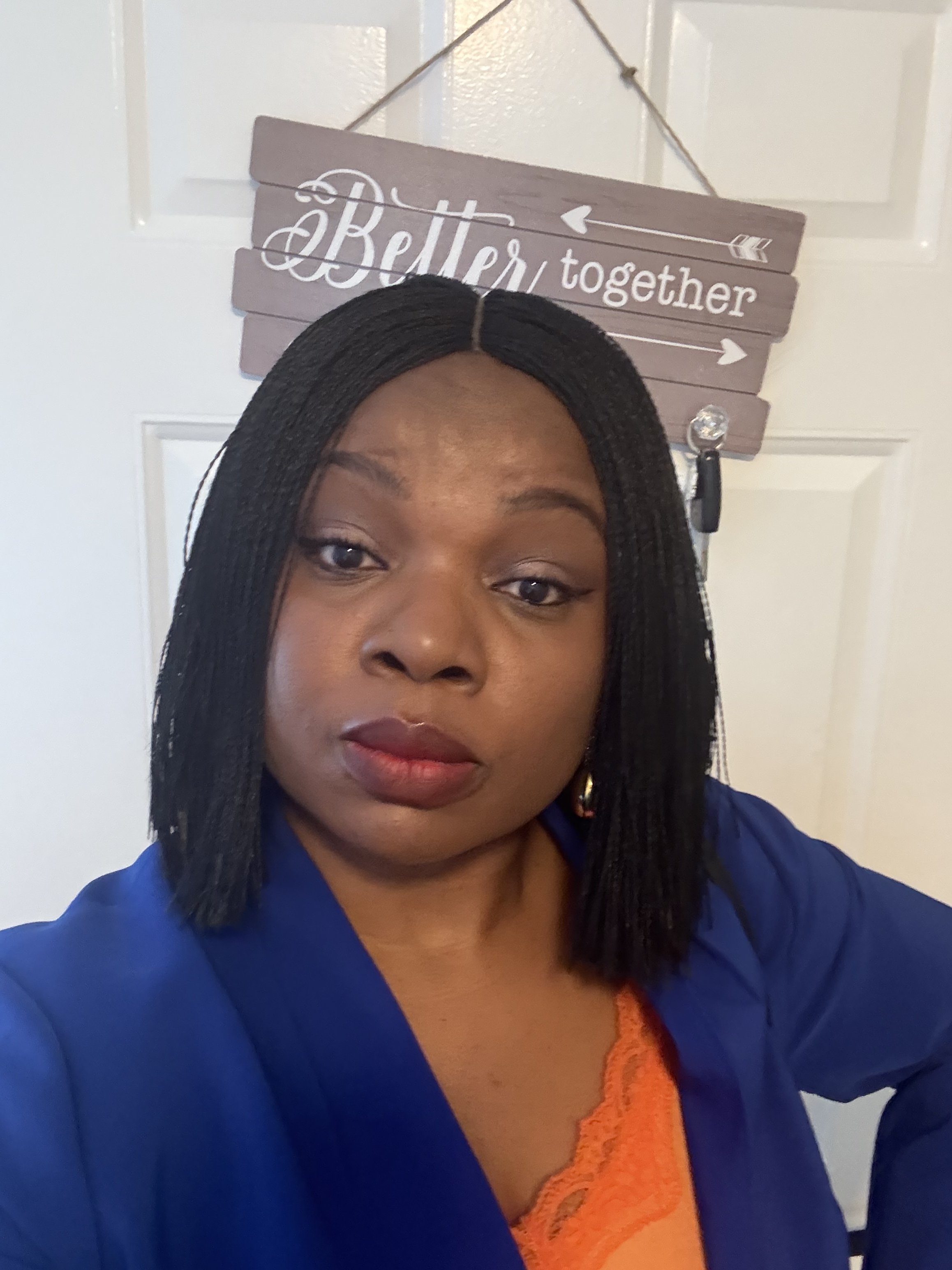 Woman with short hair and blue blazer