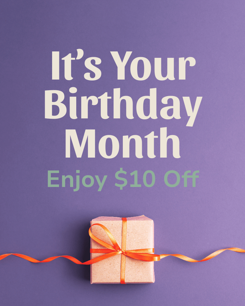 Birthday month spa promotion graphic offering $10 off services with gift box on purple background