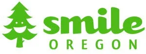 logo for Smile Oregon in green on white background