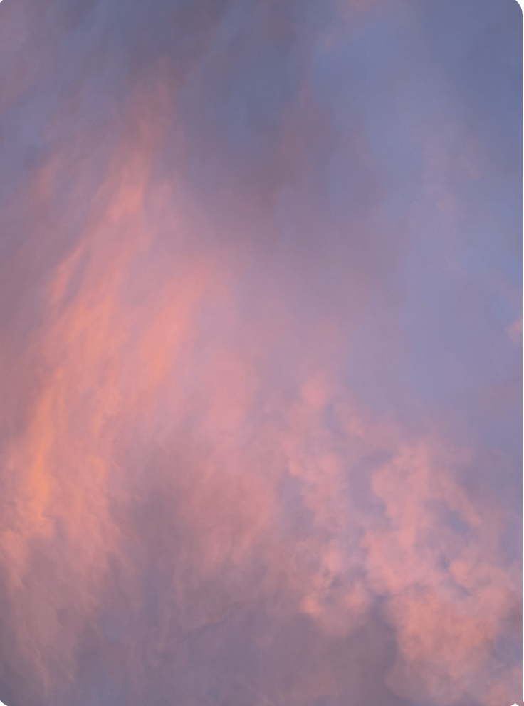 Colorful sky during sunset with pink and purple clouds. An unedited photo of the real sky in Queens, NY.