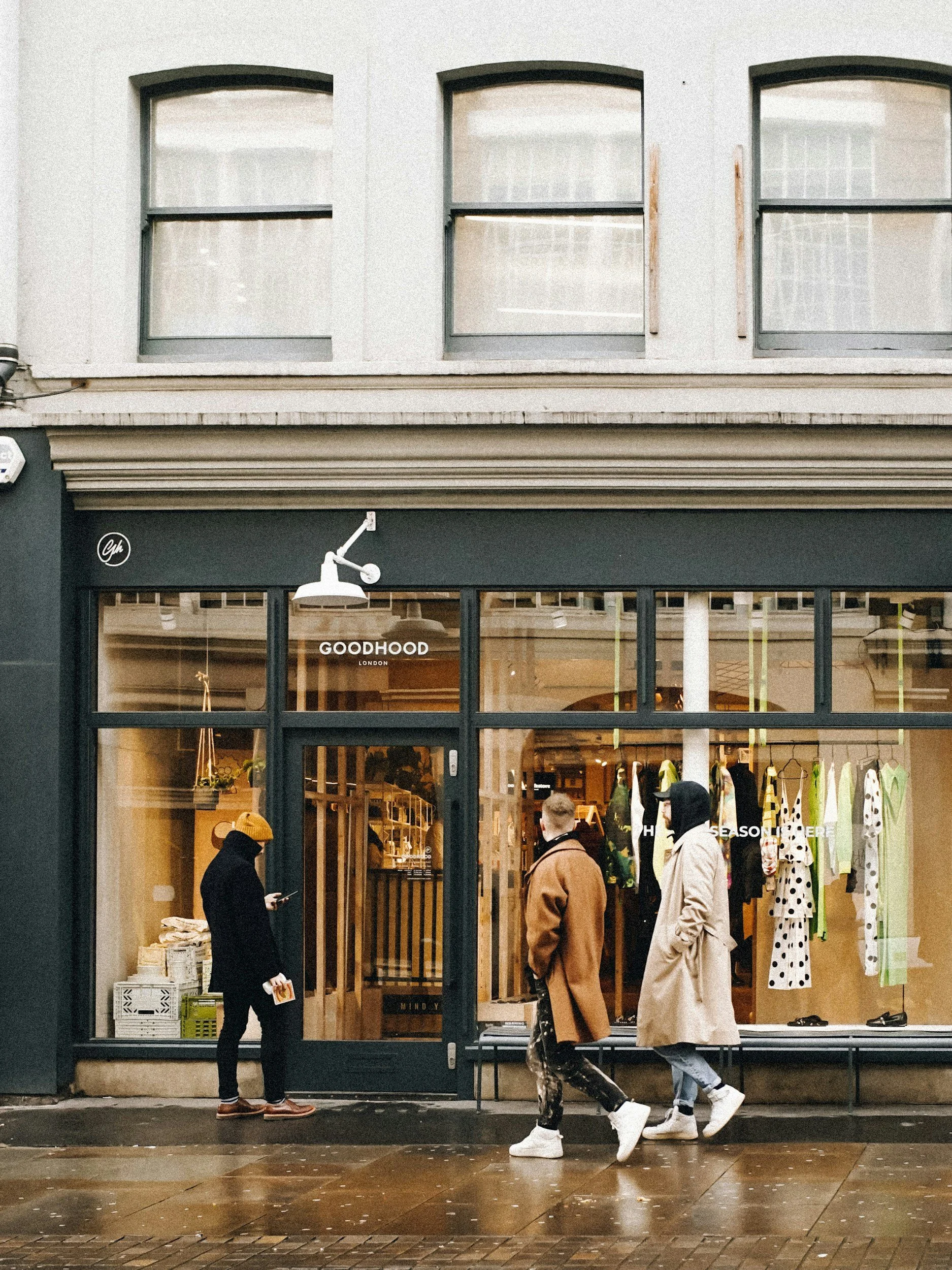 Customers outside a shop window