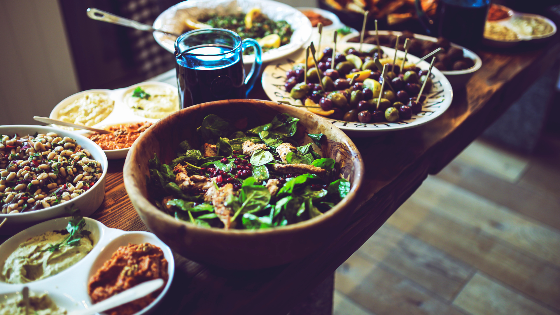 A table is laid with bowls of salads and entrees.