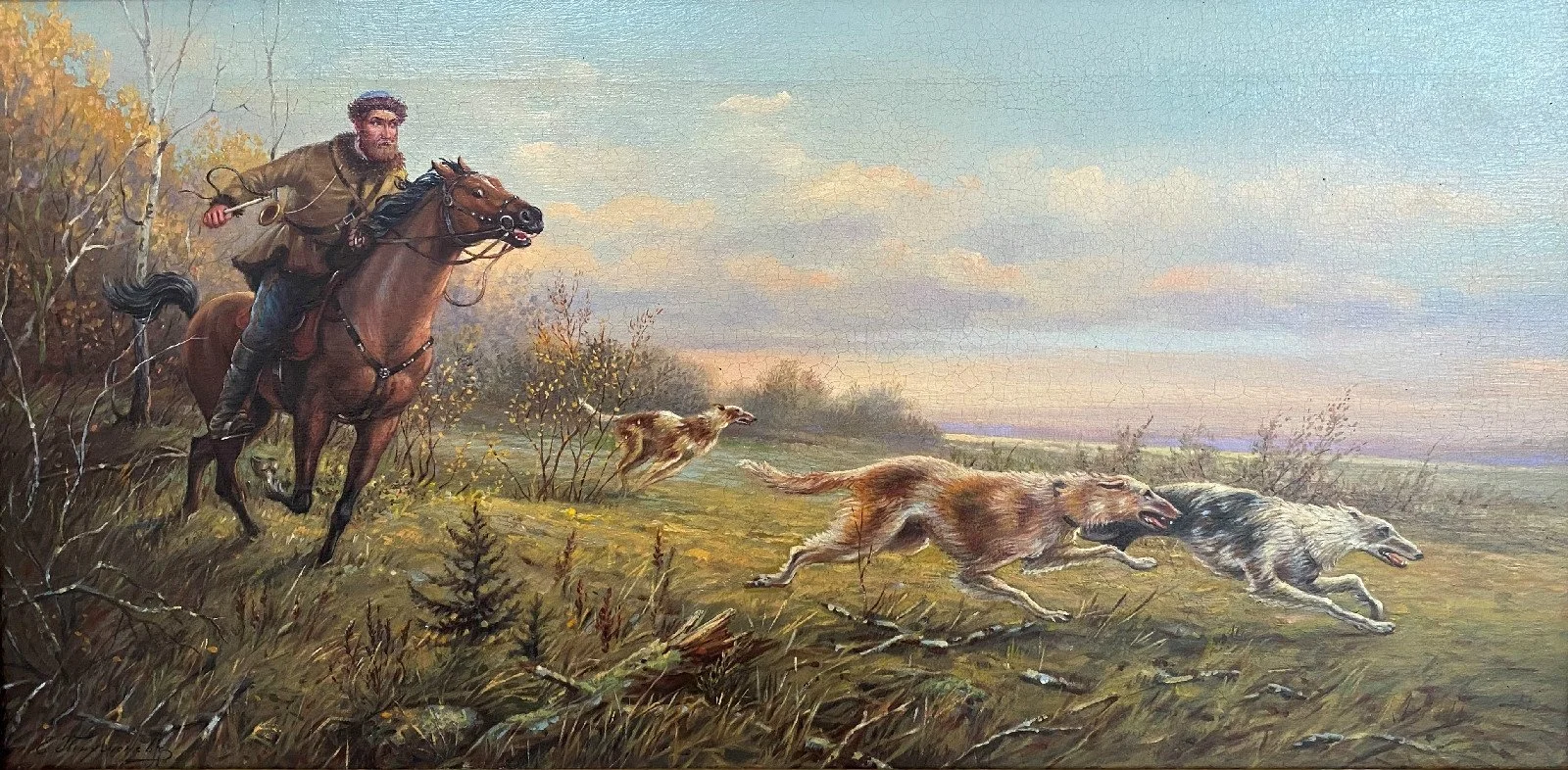 A man on horseback chasing three running wolves and a dog in a grassy landscape under a blue sky with clouds.