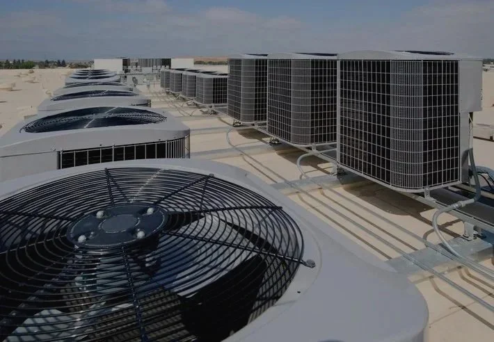 Multiple air conditioning units installed on a rooftop.