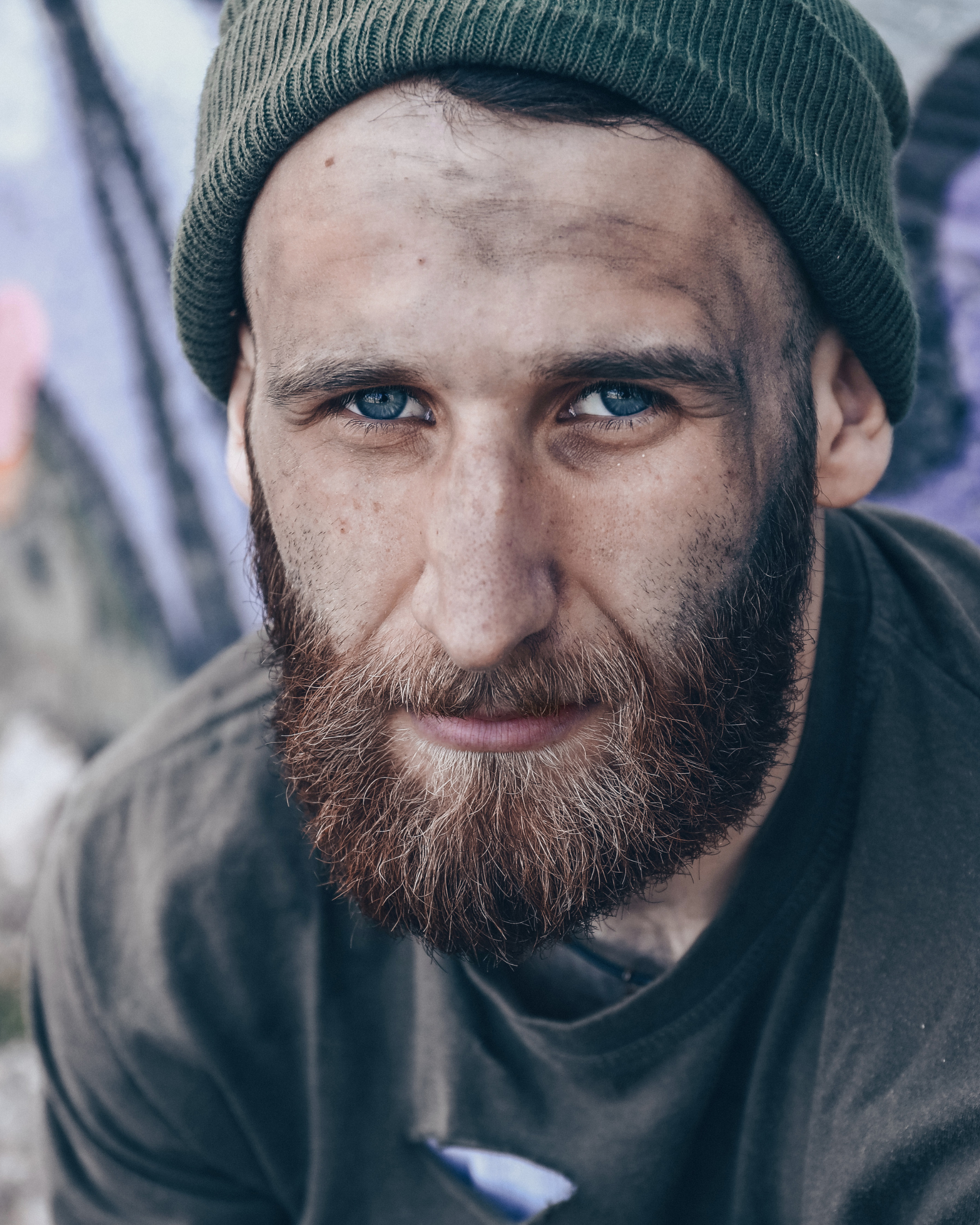 Shows a homeless man with hope in his eyes