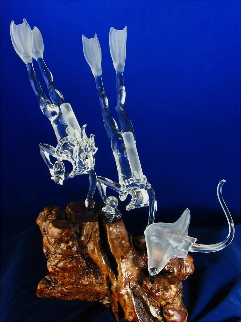 Male and Female Scuba Divers with Stingray