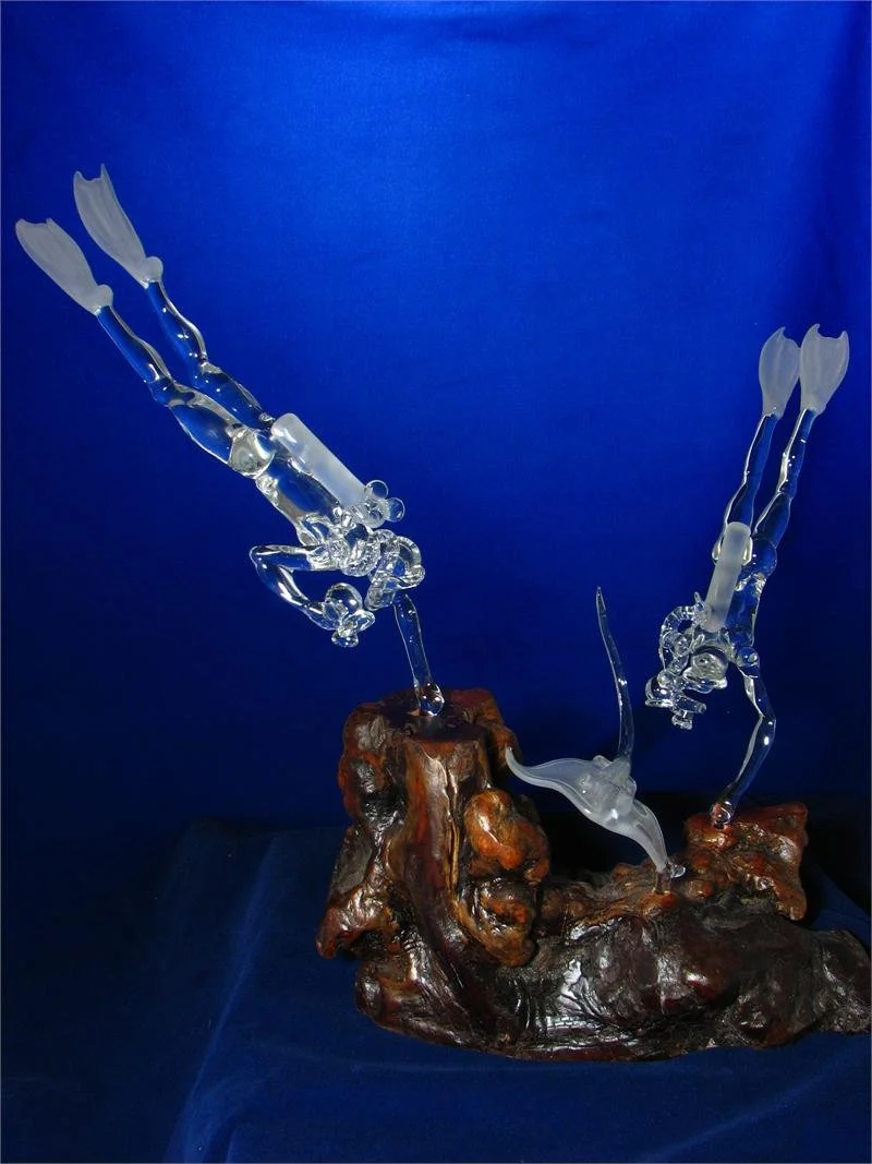 Two Male Scuba Divers with Stingray