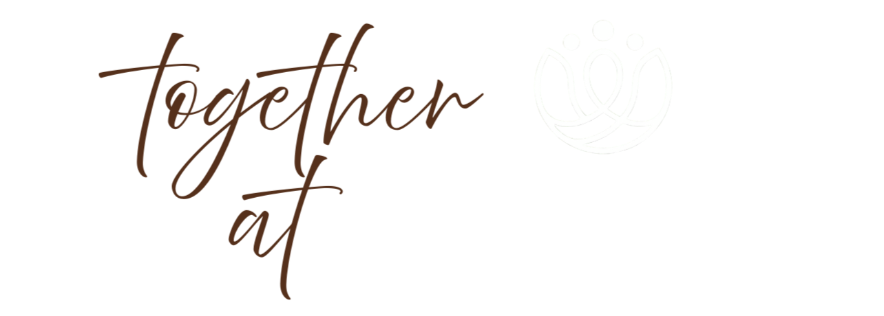 Logo with stylized text saying "together at the well" and a simple line drawing of three flowers or lotus shapes.