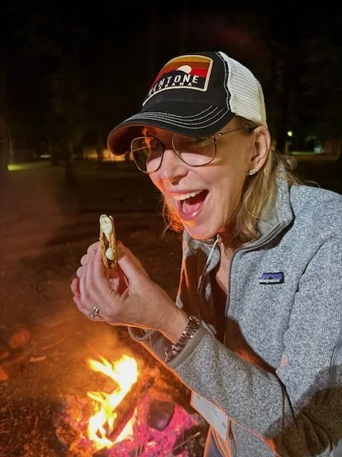 Lori at campfire with s'mores