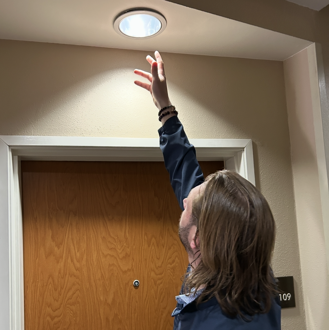 Electrician checking lights at hotel in Tulsa.png