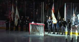 first responders being honored at hockey match
