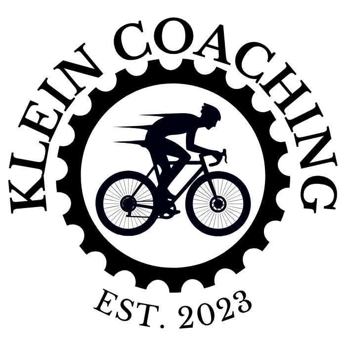 Silhouette of a person riding a mountain bike, wearing a helmet, with a dark background and motion lines indicating speed.