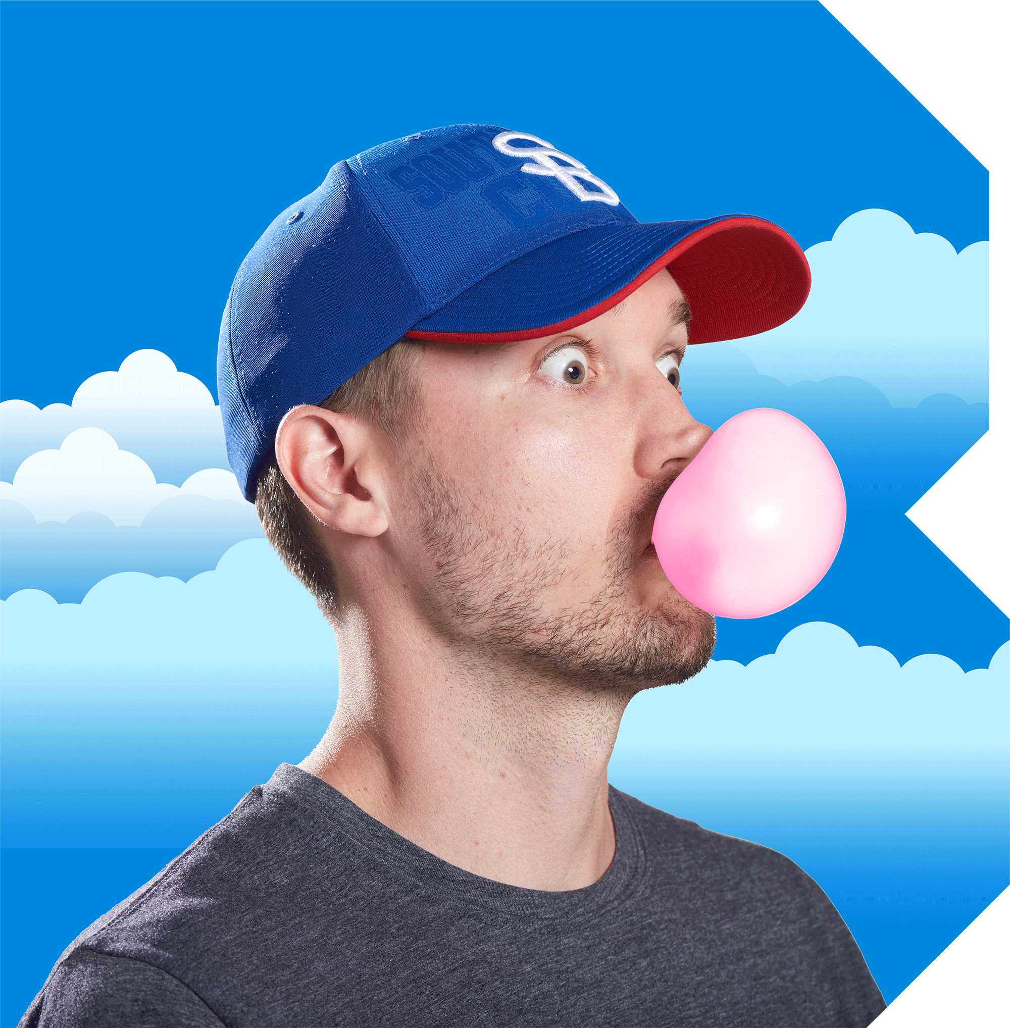 Man wearing a blue baseball cap blowing a pink bubblegum bubble against a blue sky with white clouds background.