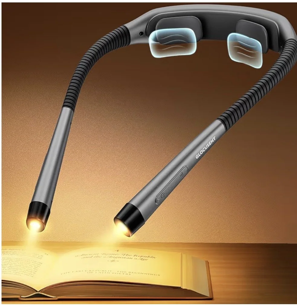 A futuristic device with two Nova lasers pointing downwards, illuminating a book on a wooden surface.