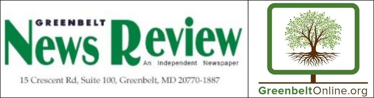 The image shows a banner with the logo of Greenbelt News Review, an independent newspaper based in Greenbelt, Maryland. There is also a green-and-brown sign with a tree logo and the website GreenbeltOnline.org.